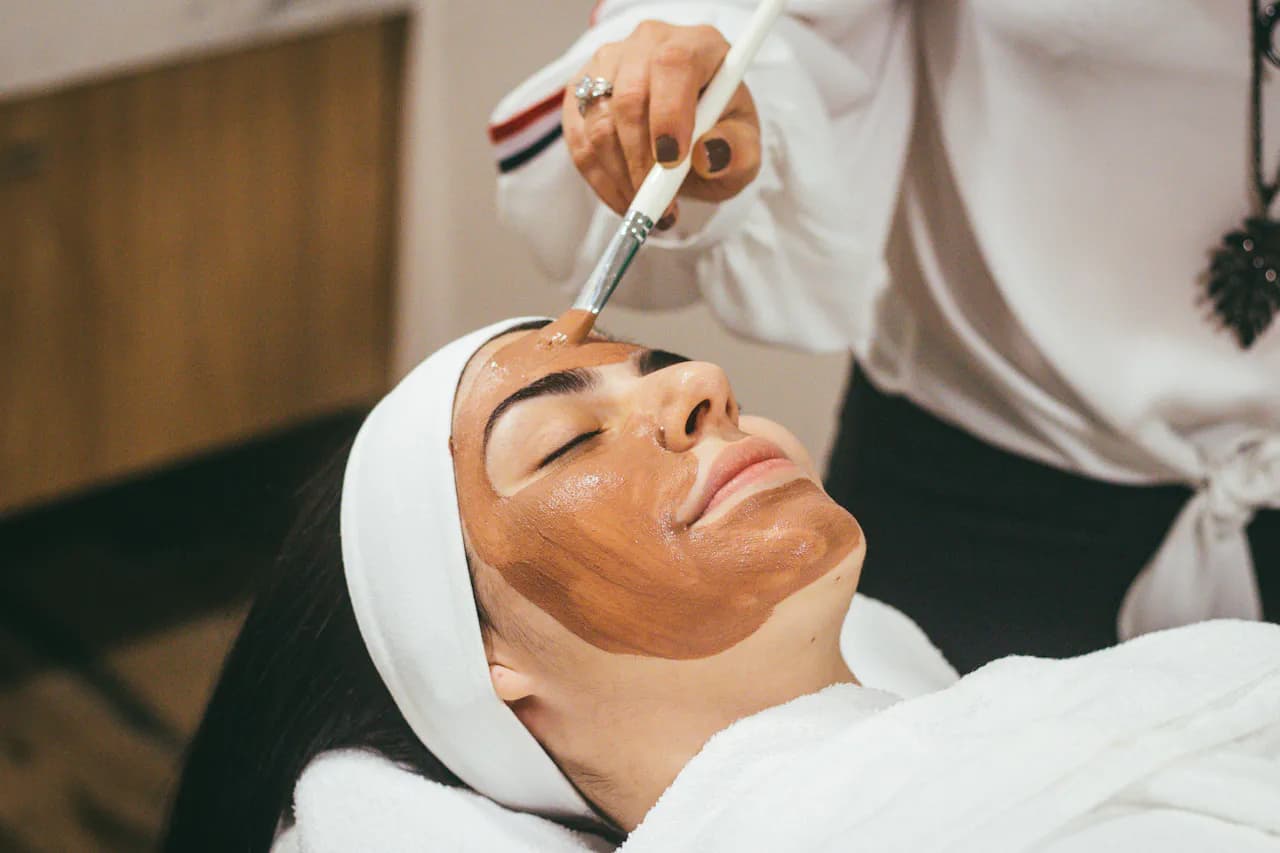 A client relaxing during a professional facial treatment at a medical spa